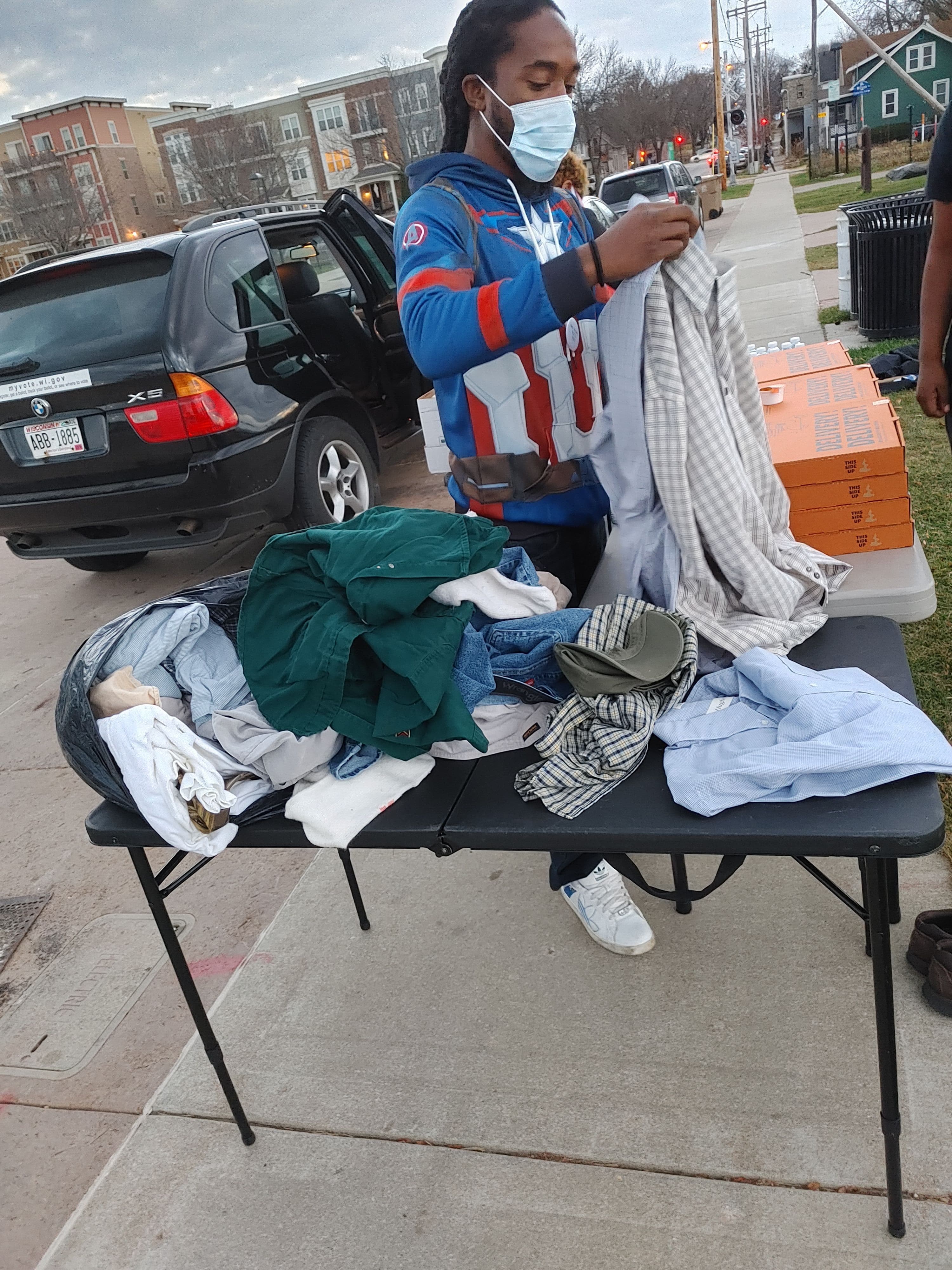Rodney volunteering with Black Umbrella donate clothing and food in the cold winter days